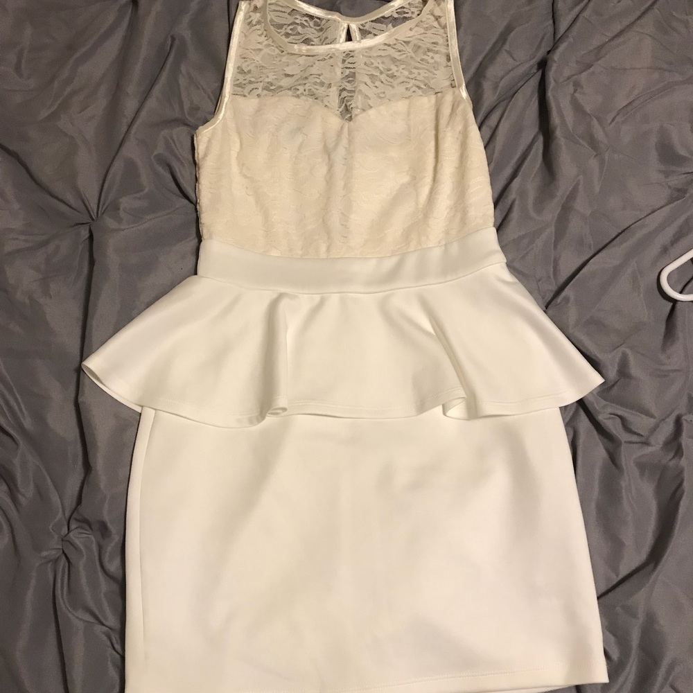 A mid dress layered with a wavy layer, a laced top